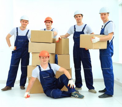 Professional movers loading furniture for a Harringay relocation