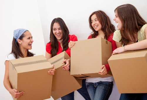 Van transport service with furniture and boxes being handled