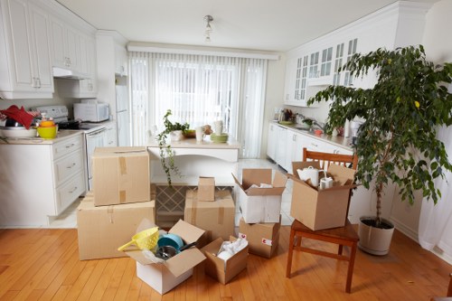 Packed office furniture and boxes prepared for commercial moves in Harringay