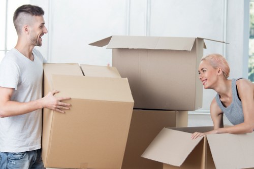 Unpacking boxes and arranging belongings in a new Harringay home