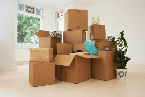 Packed moving boxes and furniture ready for a Harringay home removal