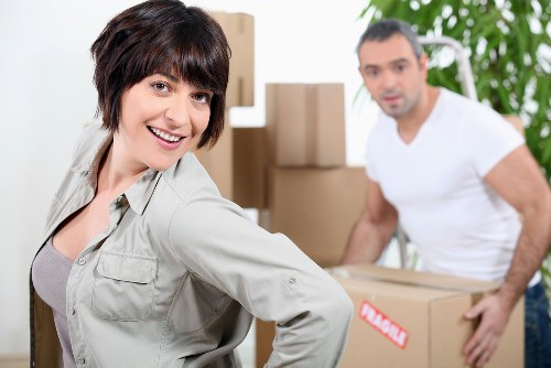 Professional man and van moving boxes in Harringay